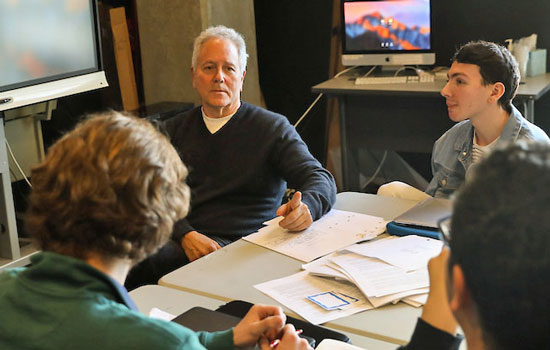 David Hoberman offers one-on-one guidance during campus screenwriting workshop.