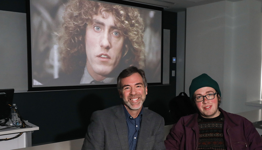 The face of The Who's Roger Daltrey is projected on a screen behind Quentin Miller and Caleb Elfland