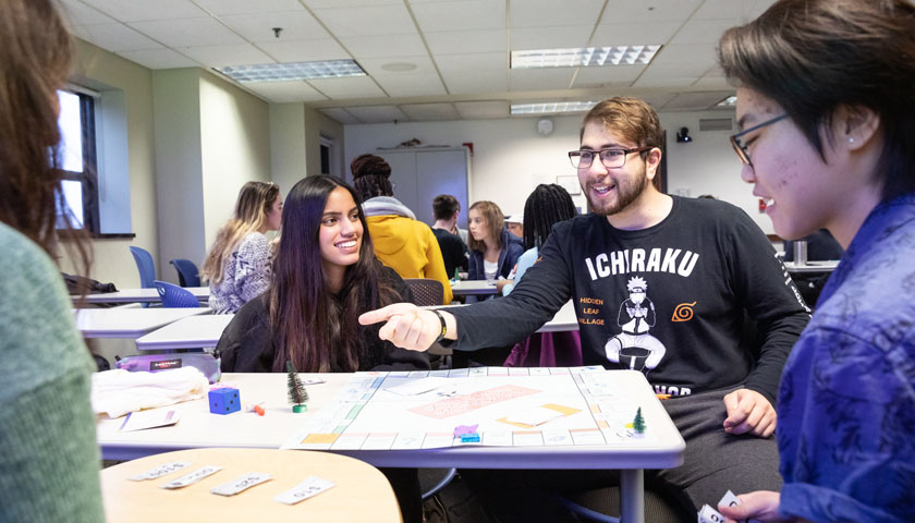 Students laugh while playing game in class