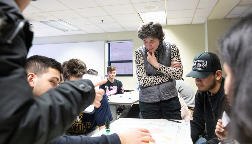 Professor Enyedy observes students playing Pollution Monopoly