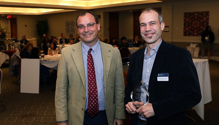 Sebastian Royo and William Johnson, who is holding