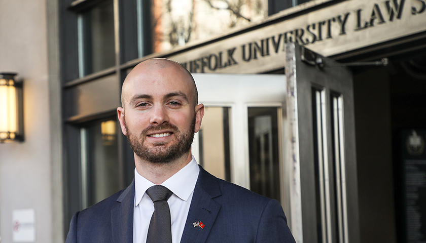 Justin Rhuda in front of Sargent Hall