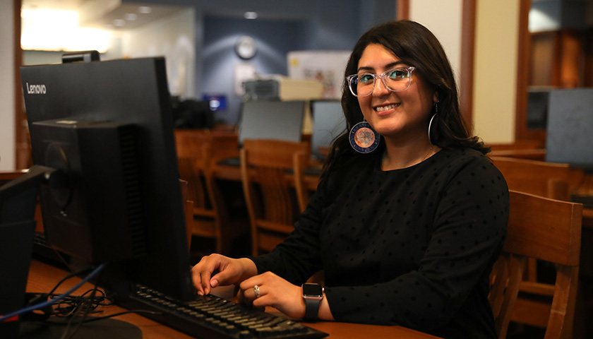 Isis Garcia-Rodriguez sitting at computer