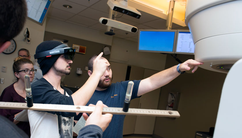 Physics students in a radiation therapy room at Massachusetts General Hospital