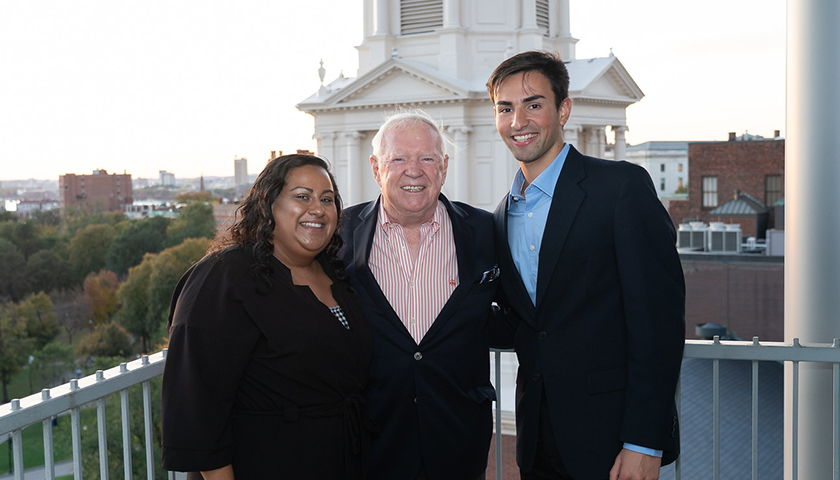 Mayra Gonzalez, Class of 2021, and Steven Lopez, Class of 2020, flank Ed McDonnell, BSBA '59, HDCS, '84