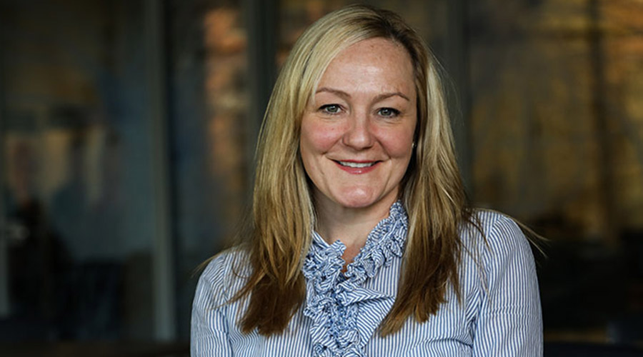 Student sitting in a Suffolk University building