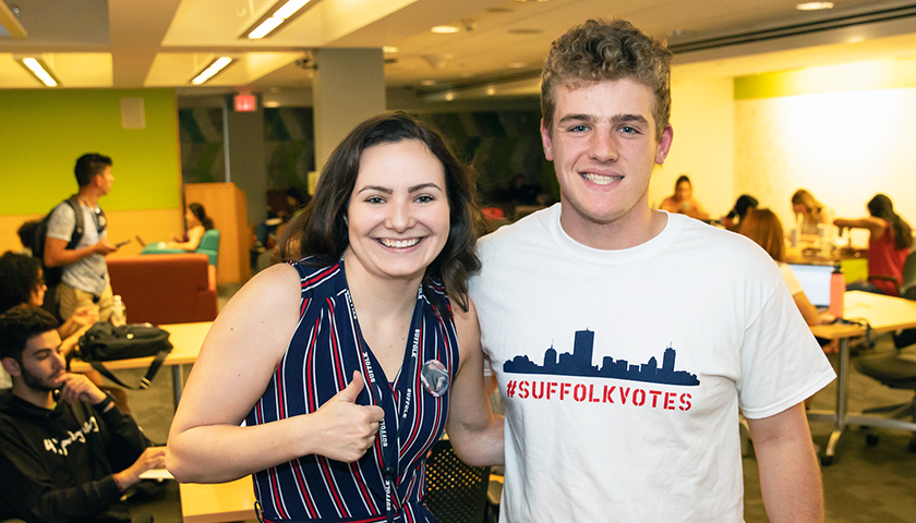 Sabrina Holland wearing red, white, and blue with Devon Rutter wearing Suffolk Votes T-shirt