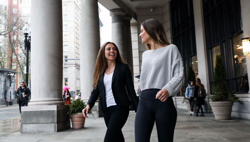 Shair Myers and Julianne Jeha walk outside Suffolk's Sargent building