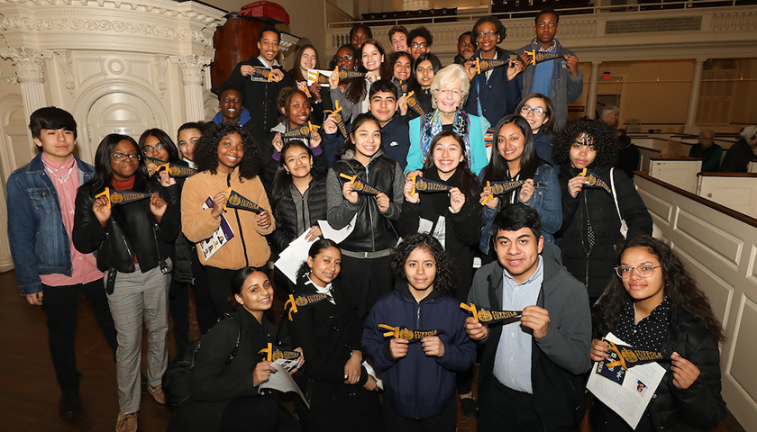 Margaret Marshall surrounded by high school student