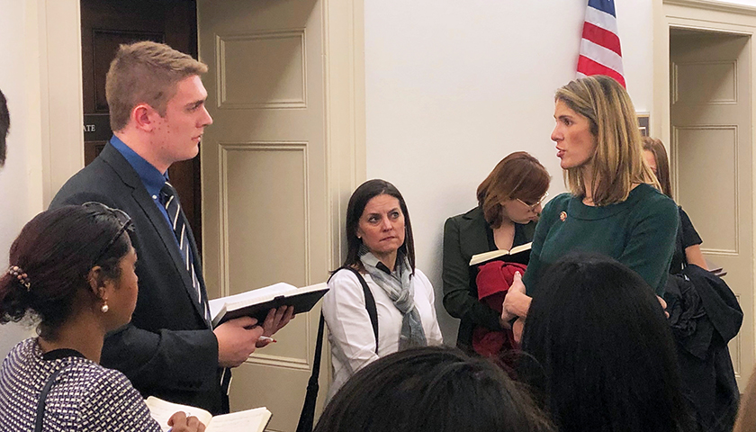 Student and congresswoman in conversation