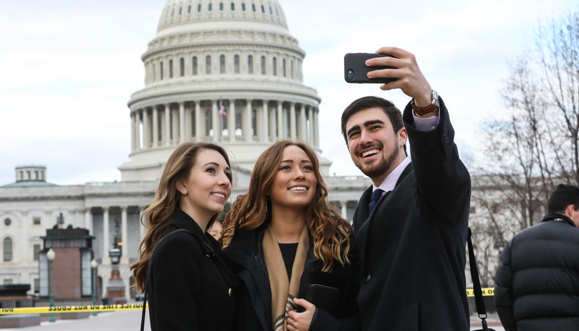 Alexandra Polaski and two classmates in front of the Capitol building