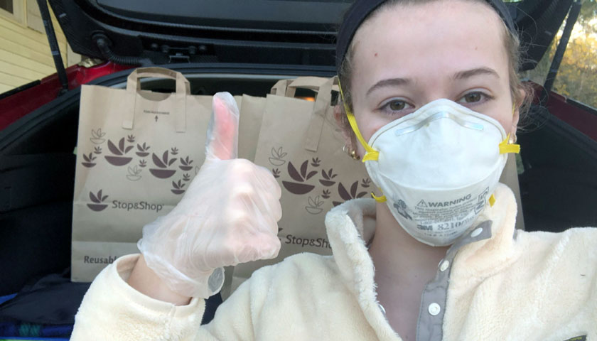 Isabel Greenstein delivers groceries to Christopher's Haven