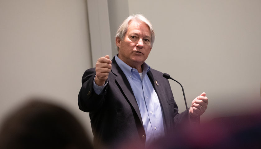 Former U.S. Representative Dennis Ross addresses students