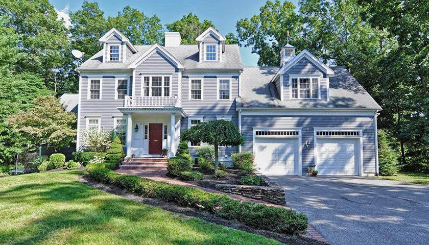 Large house surrounded by greenery