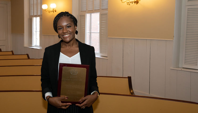 Leah Grannum holds her Creating the Dream award 