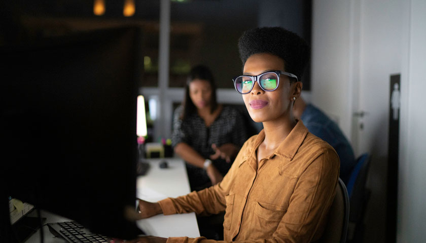 woman works at a computer