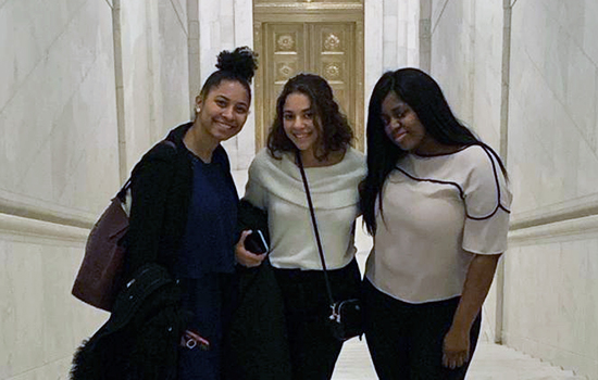 Three women inside Capitol building