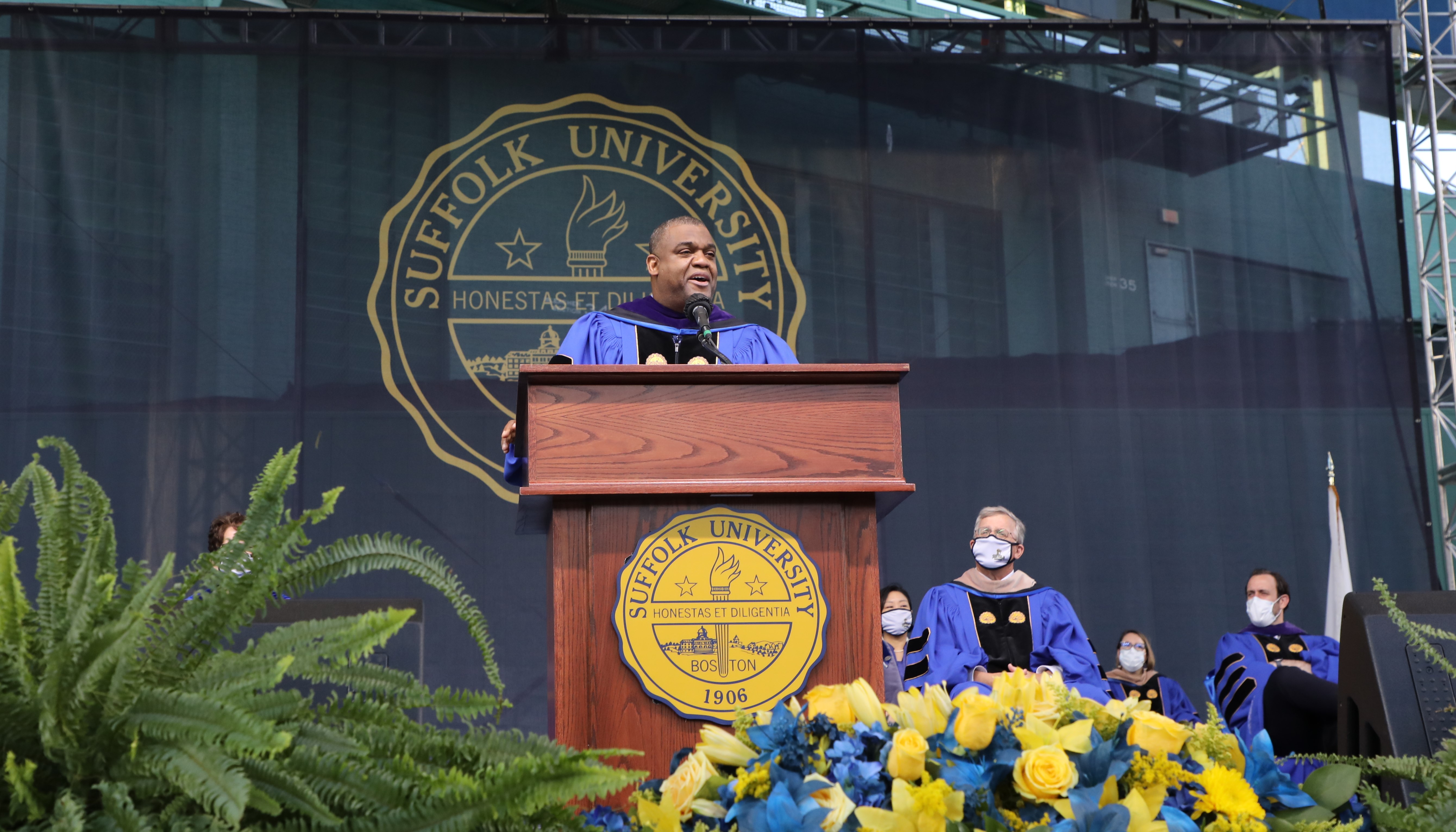 The Hon. Serge Georges Jr. speaks on stage at the College of Arts & Sciences Commencement