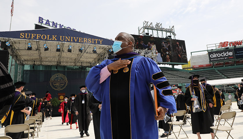 After delivering the keynote address at the Suffolk University Law School commencement, the Hon. Serge Georges Jr. — an associate justice of the Massachusetts Supreme Judicial Court (SJC), as well as a Suffolk Law alumnus and adjunct faculty member — waves to the new graduates.
