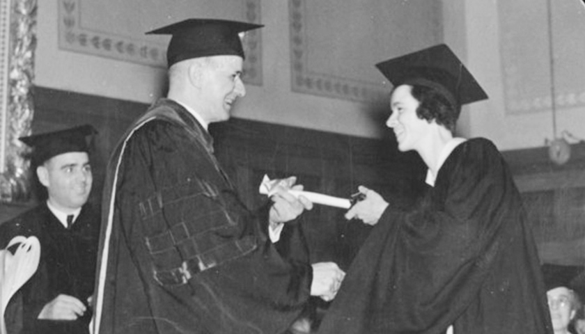 Gleason Archer confers a law degree on his daughter Marian, the first woman to graduate from Suffolk University Law School