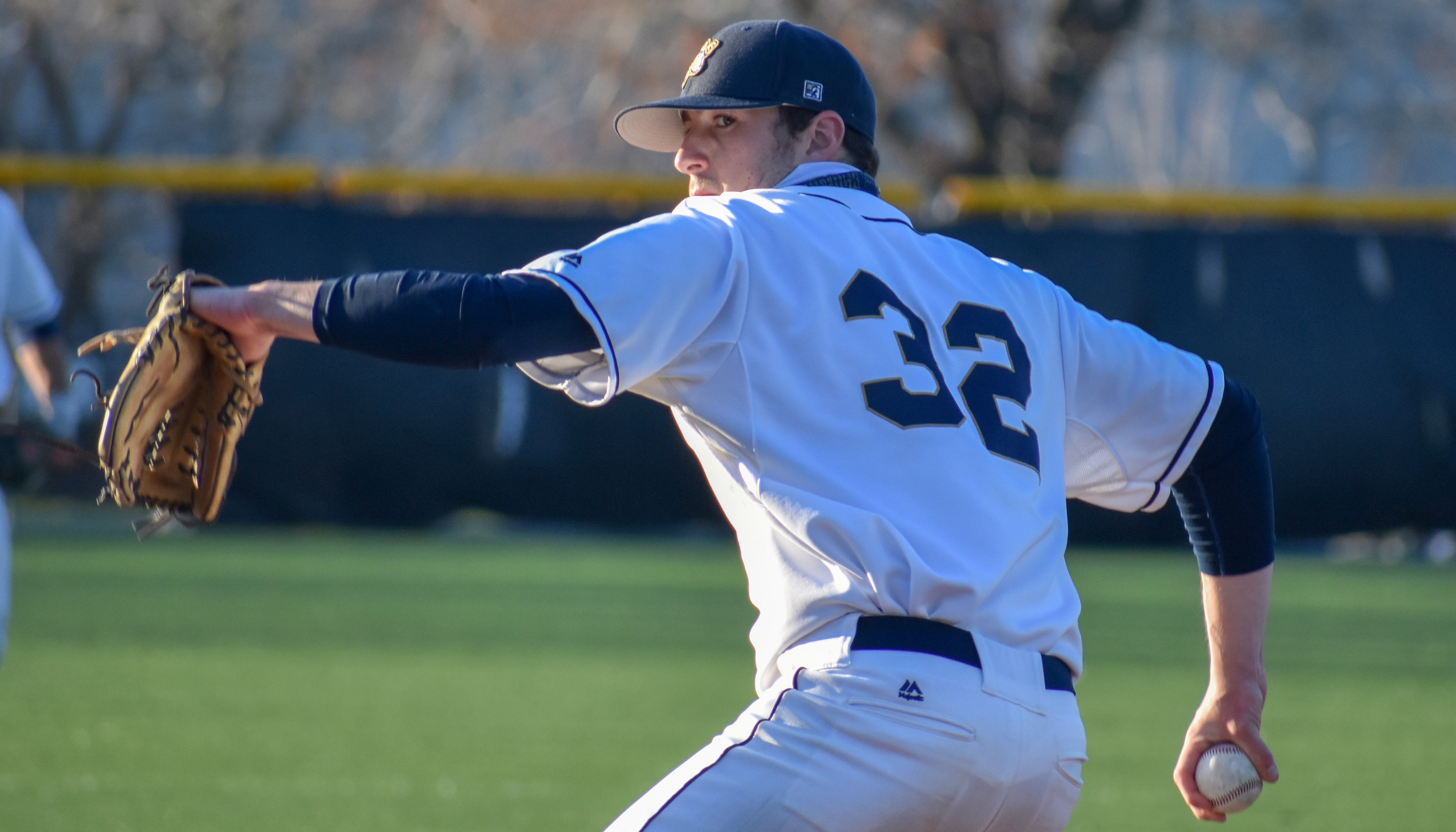 Steven Rossi in a Rams uniform pitching during a game