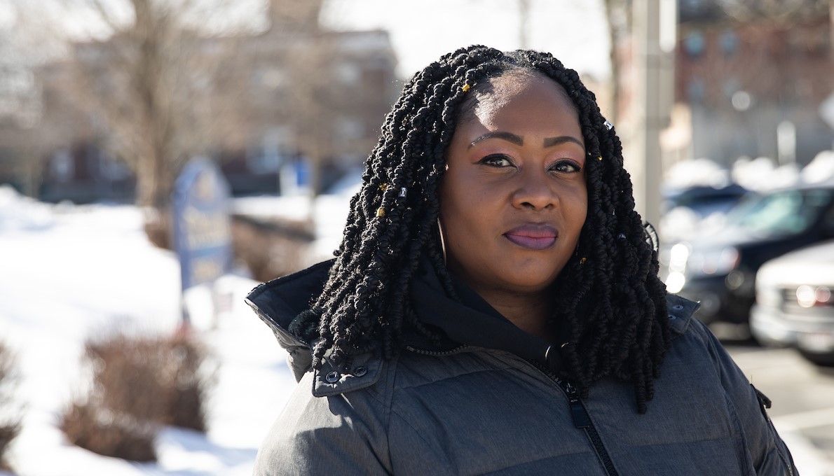 Jen Barthelmey walks down a city street