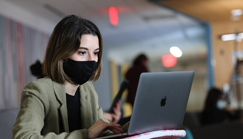 Student looking at laptop