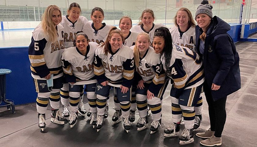 The 10 senior members of the Suffolk women's ice hockey team with Head Coach Taylor Wasylk