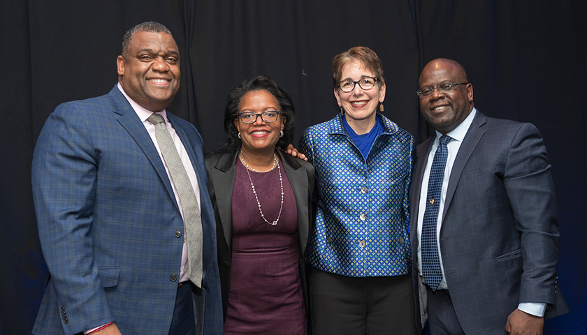 Serge Georges, Jr., JD ’96, HLLD ’21, Linda Dorcena Forry, President Marisa Kelly, University Trustee Ernst Guerrier, BS ’91, JD ’94