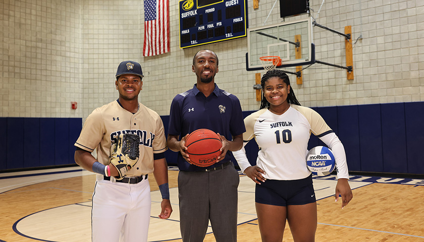 Adam Skaggs on the Suffolk basketball court with with brother-and-sister standouts Michael James Jr., Jasmine James