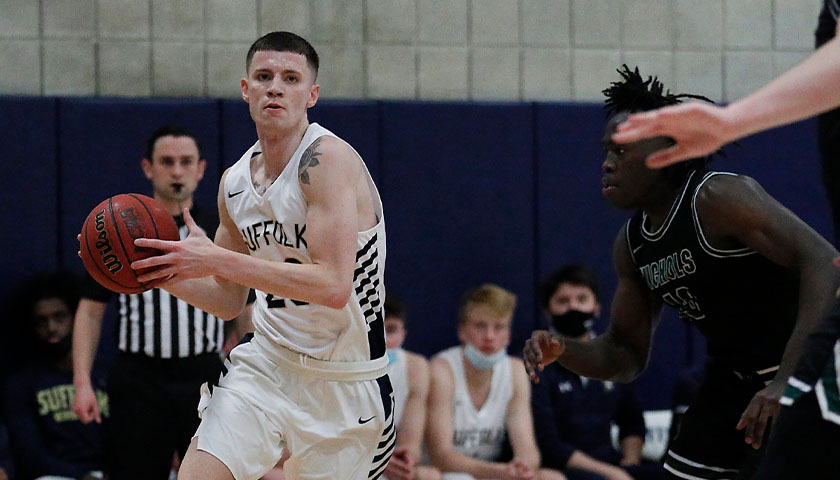 Suffolk basketball co-captain Nate Hale charges forward with the ball