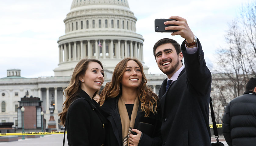 Suffolk students taking selfies in front of the US Capitol