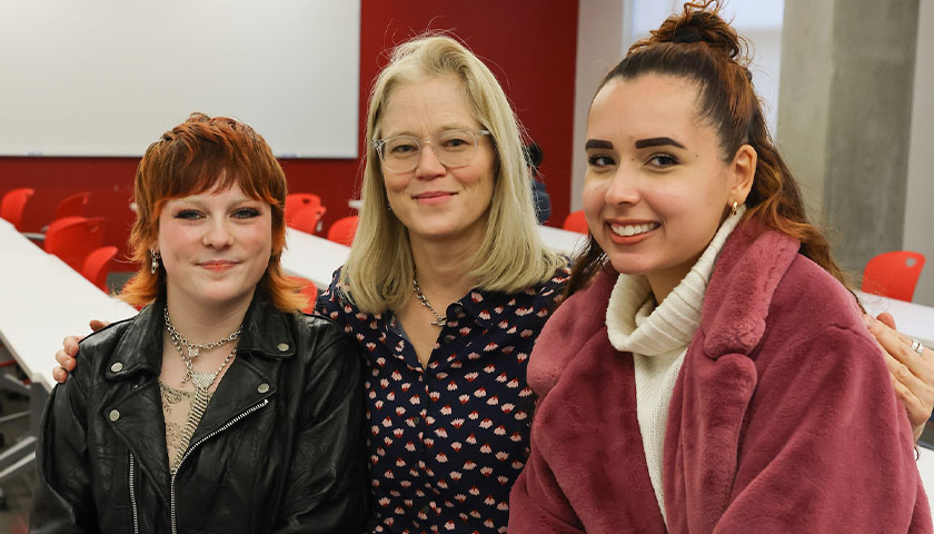 Mac Brown, Elif Armbruster, Lauren Muro-Belandria in a Suffolk classroom