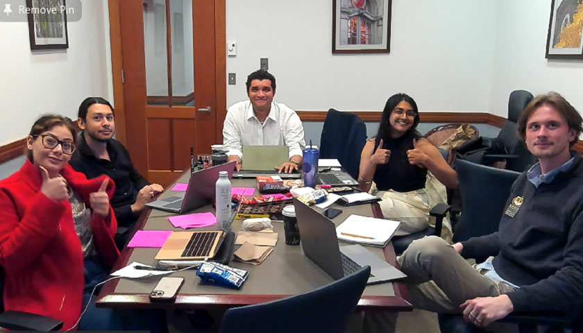 A Suffolk Law team brainstorms during the Legal Design Challenge