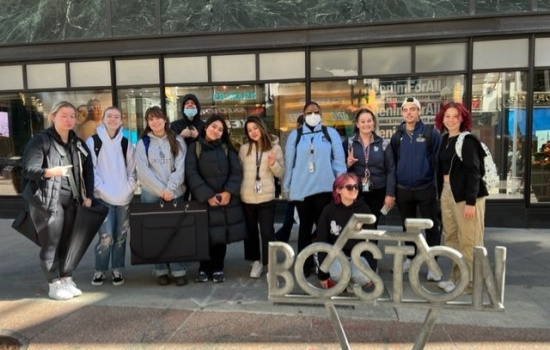 Undergraduate art & design students in front of the installation