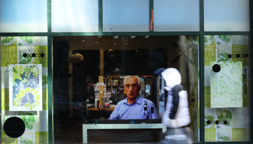 a pedestrian walks in front of the downtown crossing installation