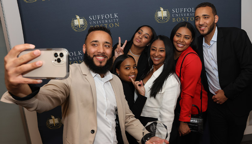 Honoree Jeffrey Lopes takes a selfie with a group of friends including his twin brother