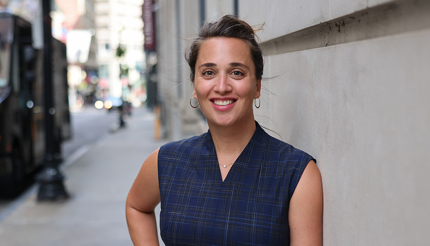 Professor Sarah Schendel standing in front of Suffolk Law