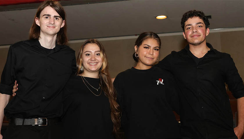 Pasión Latina dance team members Owen Byrnes, Samantha Restrepo, Ashleigh Bautista, Raymond Riel after a performance at Josiah Quincy Elementary School