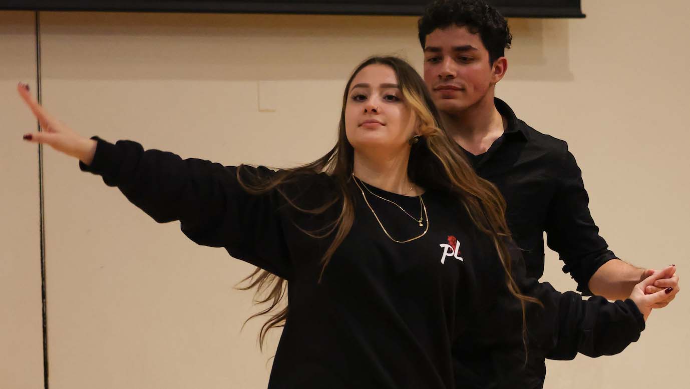 Pasión Latina members Sam Restrepo and Raymond Riel perform a salsa dance