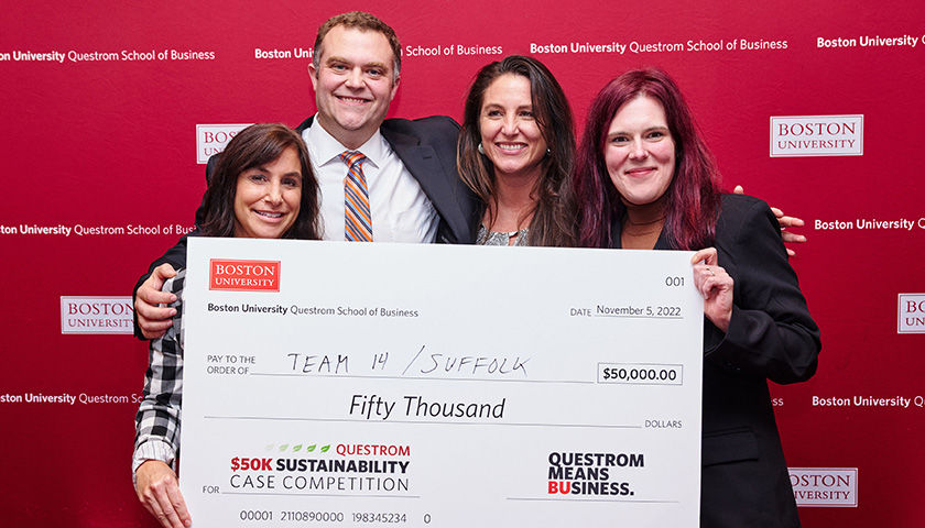 Rachel DiGiammarino, Matthew Sacchi, Jennifer Hernandez, and Jillian Garner holding their $50,000 prize from the Questrom Sustainability Case Competition
