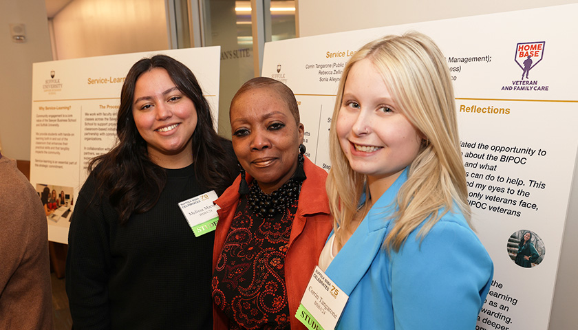 Melissa Martins and Corrin Tangarone, Class of 2024, flank Professor Sonia Alleyene