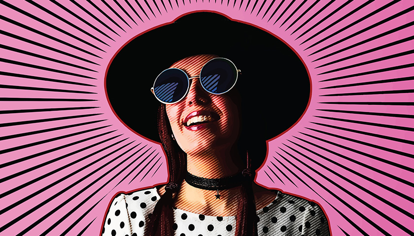 Funky photo illustration of smiling Gen Z woman with sunglasses and hat