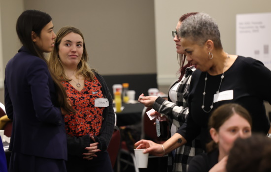 Rep. Erika Uyterhoeven, left, speaks with attendees at the Decarcerating Women Today: Charting a Path conference