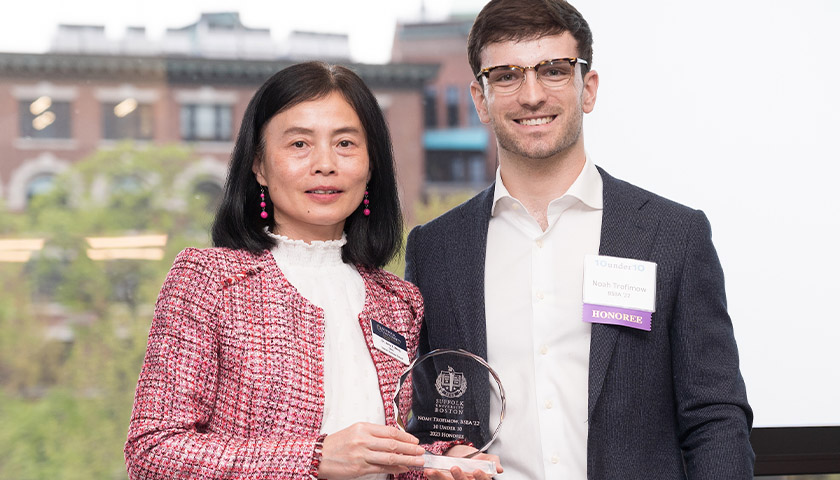 Sawyer Business School Dean Amy Zeng and Noah Trofimow