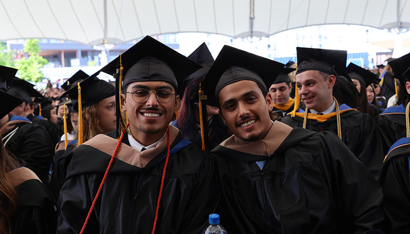 Happy graduates at the 2023 Sawyer Business School Commencement