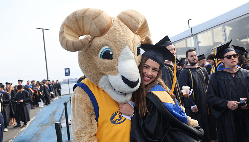 Rammy and a friend at 2023 Sawyer Business School Commencement