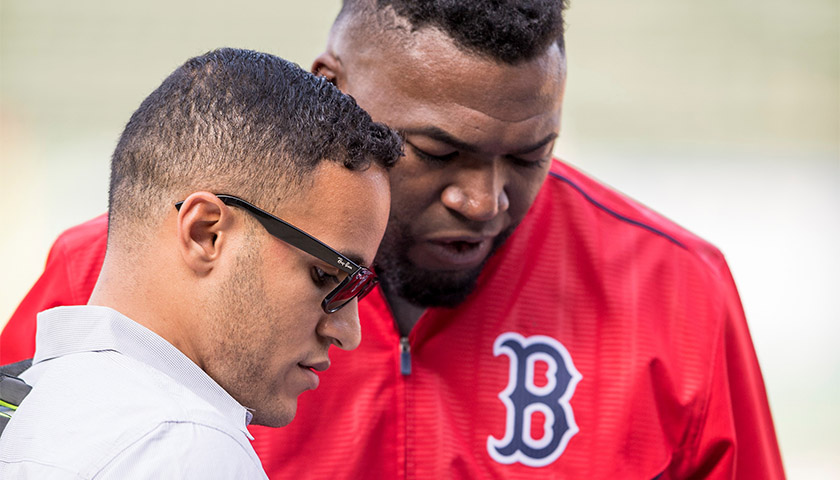 Daveson Perez interacts with Red Sox legend David Ortiz
