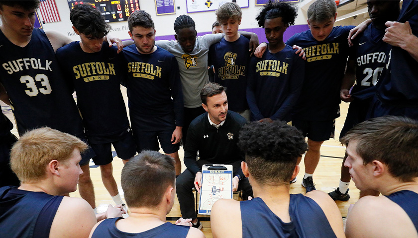 Suffolk Men's Basketball Head Coach Jeff Juron talks with members of his team