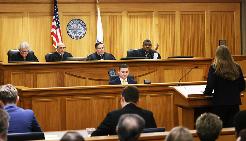 Four judges on the bench in the Suffolk moot court room